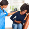 woman girl stomach cramps with nurse