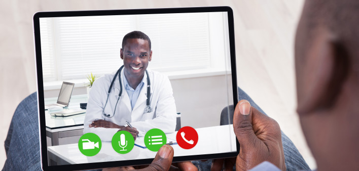 Close-up Of African Person Holding Blank Digital Tablet