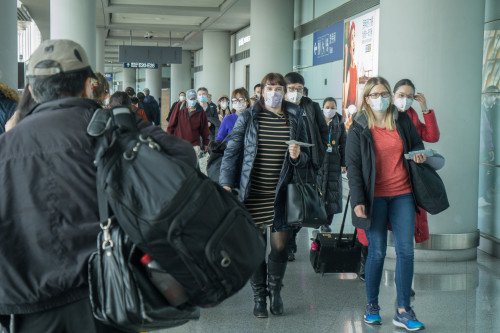 Corona Virus travelers wearing masks