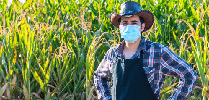 Farmer worker wearing a protective face mask due Covid-19 contagion prevention