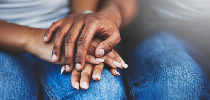 ethnic black latino man and woman holding hands