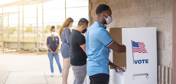 Waiting in line and voting.