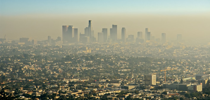 Wide shot of the downtown Los Angeles skyline bathed in smog. View from Griffith Park