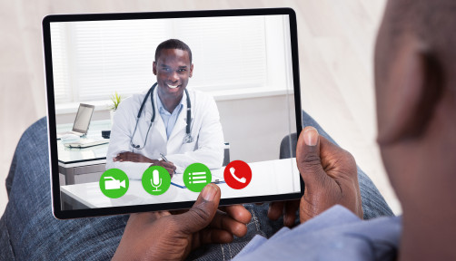 Close-up Of African Person Holding Blank Digital Tablet