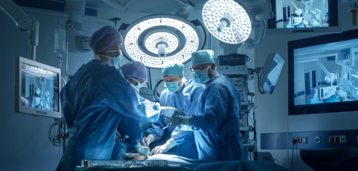Medical Team Performing Surgical Operation in Modern Operating Room
