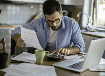 Photo of a man going through his financials problems