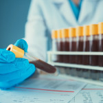Blood vials in laboratory scientist