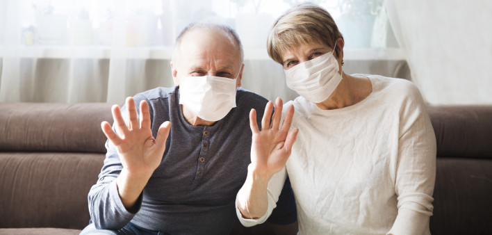 Seniors couple wearing medical face mask and recovery from the illness in home. quarantine. health concept. Corona Virus. Shelter in place