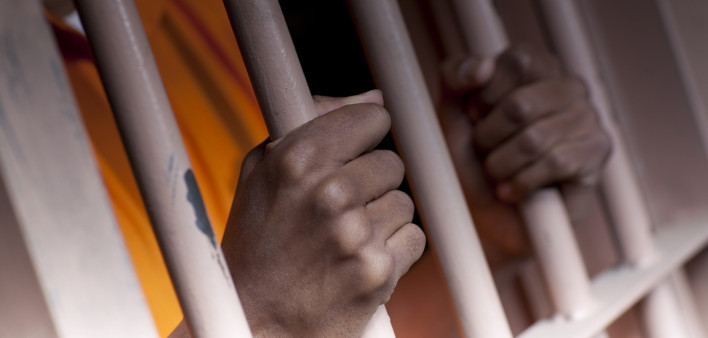 Prison Prisoner Prison Reform hands on bars