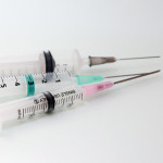 Three disposable medical syringes