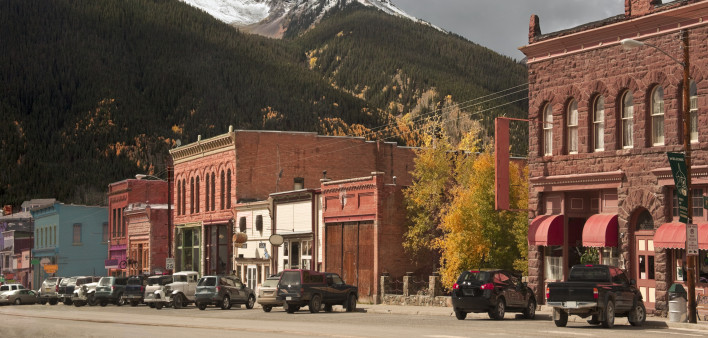 Main Street on the historic mining town of Silverton, Colorado. San Juan Mountains in the Rockies.