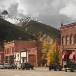 Main Street on the historic mining town of Silverton, Colorado. San Juan Mountains in the Rockies.