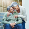 smiling couple older grey hair man wheelchair seniors