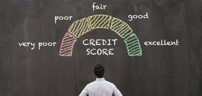 man looking at blackboard credit score