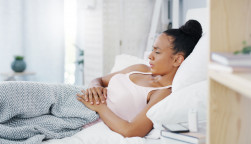 woman girl stomach cramps couch