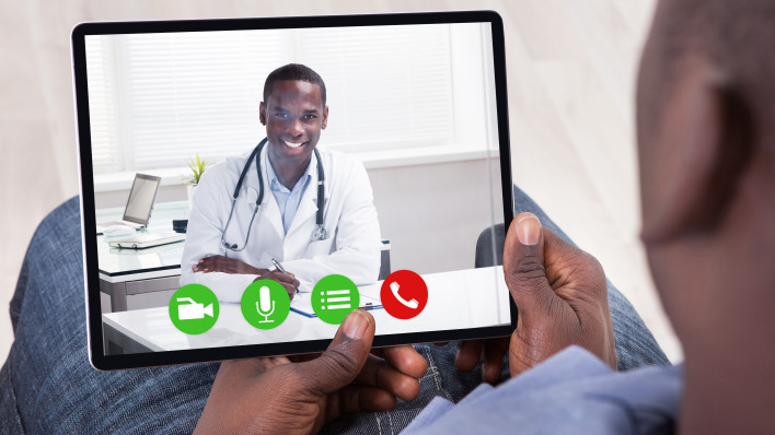 Close-up Of African Person Holding Blank Digital Tablet