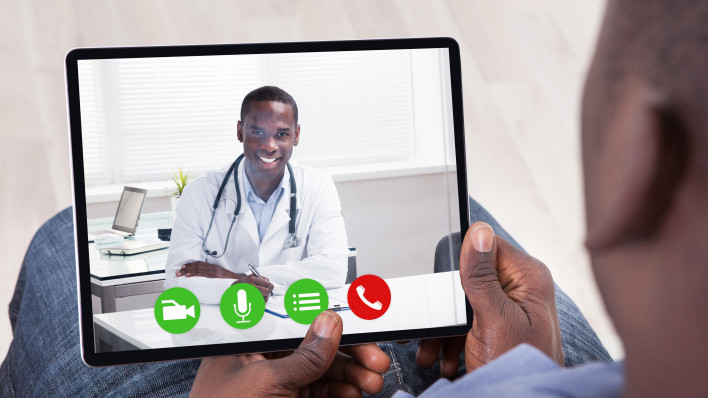 Close-up Of African Person Holding Blank Digital Tablet