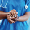 nurse's hands holding patients hands