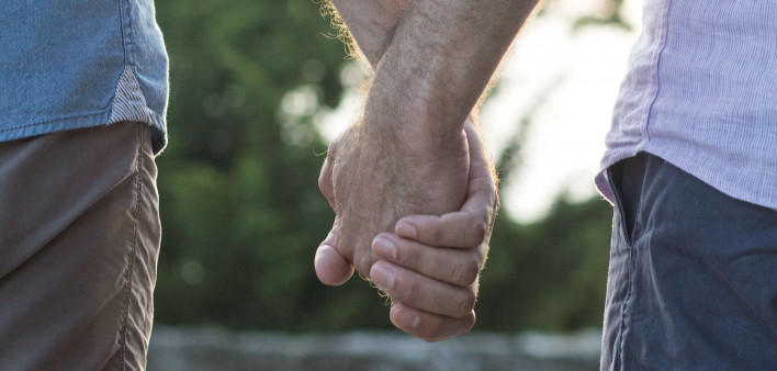 two men couple holding hands gay