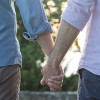 two men couple holding hands gay