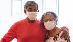 Senior couple wearing protective mask against infectious diseases