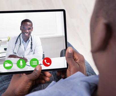 Close-up Of African Person Holding Blank Digital Tablet