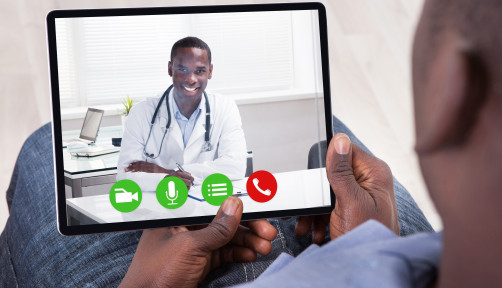 Close-up Of African Person Holding Blank Digital Tablet