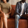 african american couple sitton on couch