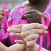 Multi-ethnic women with breast cancer awareness ribbons