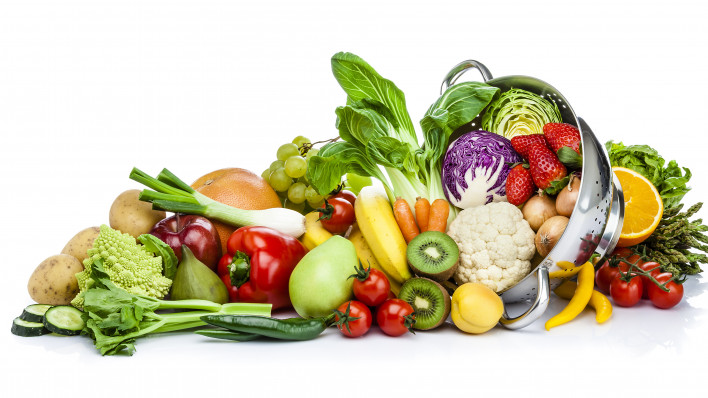 Healthy fresh fruits and vegetables in a colander