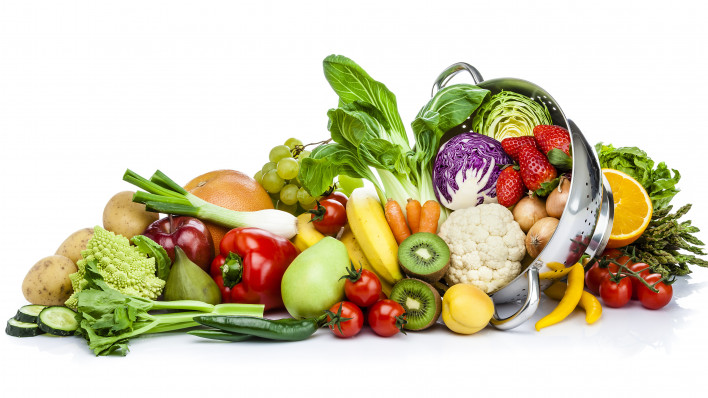 Healthy fresh fruits and vegetables in a colander