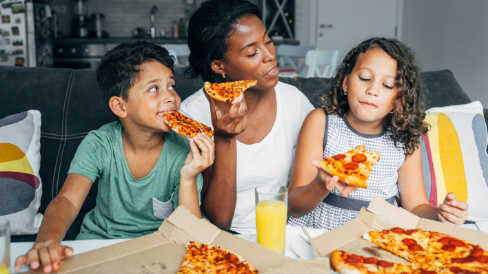 family eating pizza