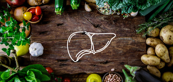 A table of food with a drawing of a liver