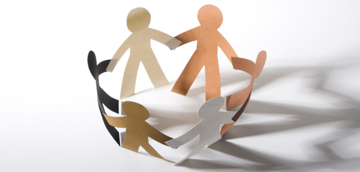 paper cut out dolls joined hands in a circle