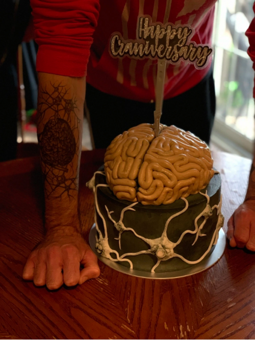 Adam poses with his fourth “cranniversary” cake on May 26, 2020. Cake by Moist Cake Co.