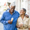 A senior african american couple enjoy an evening on the town with ice cream