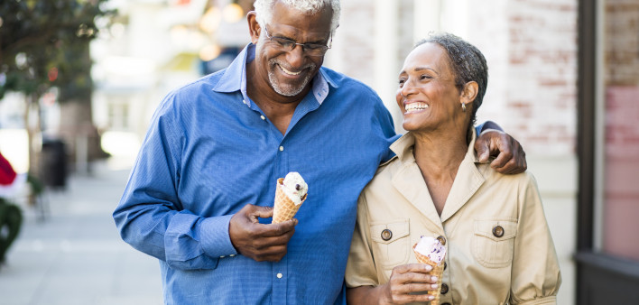 A senior african american couple enjoy an evening on the town with ice cream