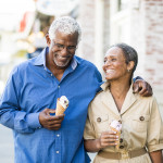 A senior african american couple enjoy an evening on the town with ice cream