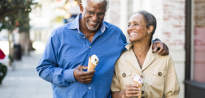 A senior african american couple enjoy an evening on the town with ice cream