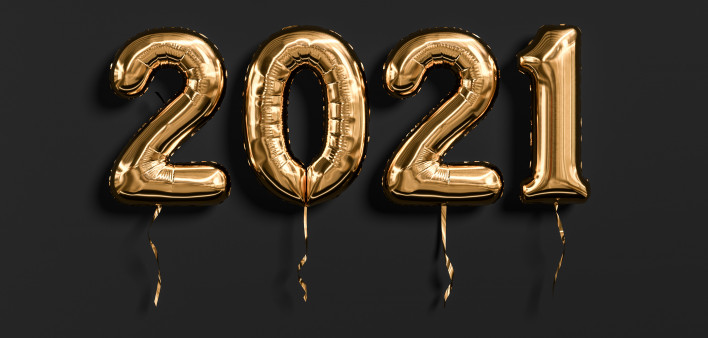 Gold foil balloons numeral 2021 isolated on black background.