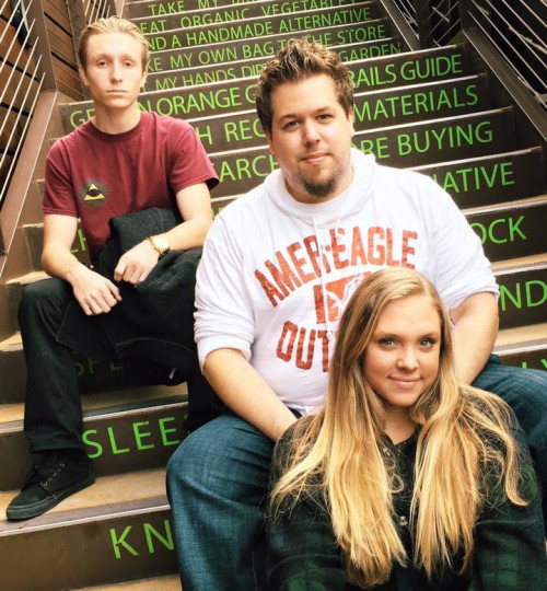 Jason Prefontaine, center, and his brother and sister