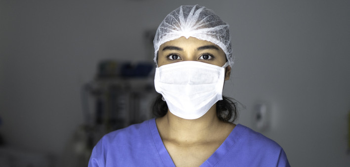 Portrait of female nurse using tablet at surgery on hospital