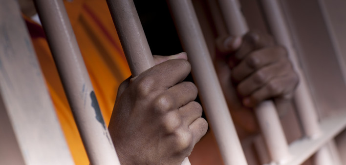 Prison Prisoner Prison Reform hands on bars