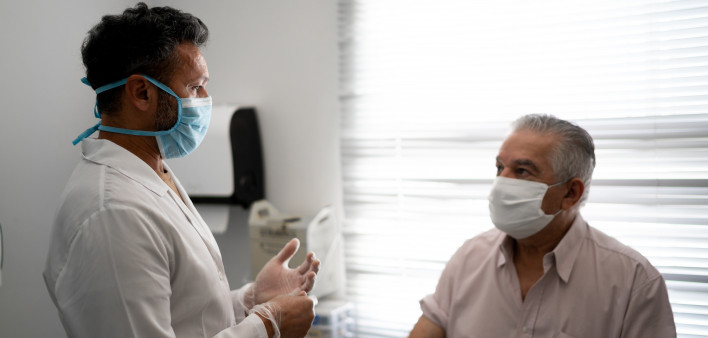 Patient in a medical consult wearing face mask