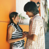 young couple holding hands and flirting