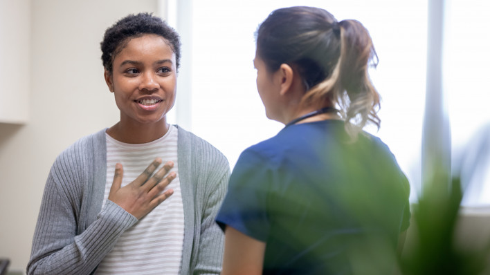 young woman taking to her doctor