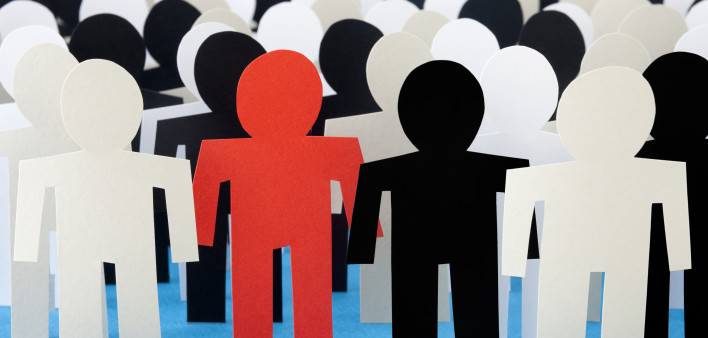 on red paper figure among others