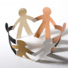 paper cut out dolls joined hands in a circle