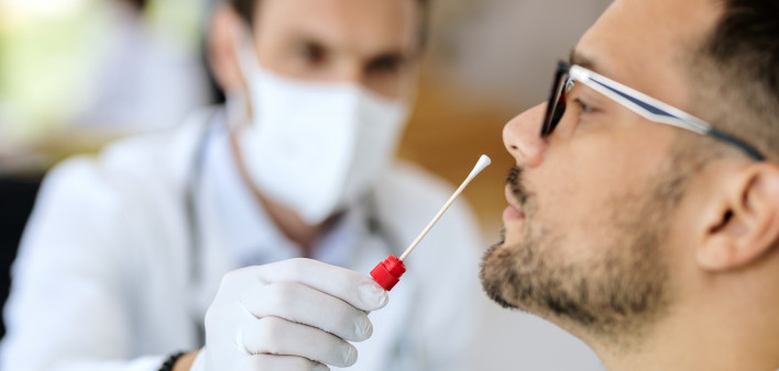 Close-up of young man getting PCR test at doctor's office during coronavirus epidemic. (56 kB)