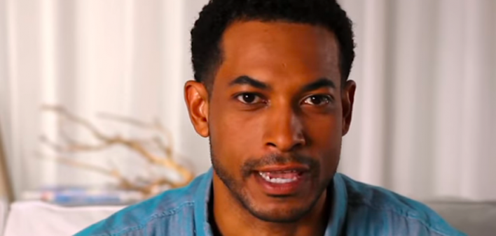 A scene from the how-to video on taking an OraQuick in-home HIV test